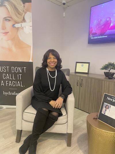 Photo of Dr. Sheila Bond sitting in lobby area of Bond Plastic Surgery